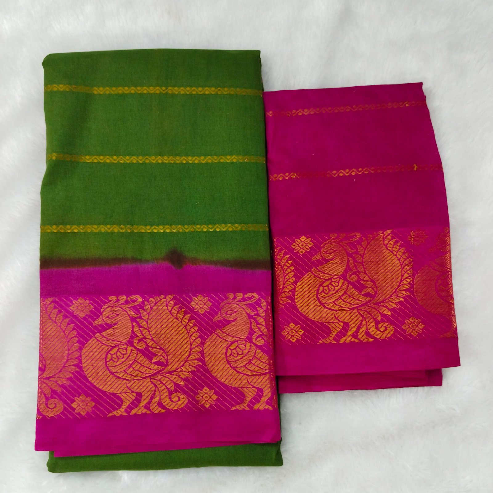 Vibrant green and rani pink contrast; festive pallu and blouse for a lively, traditional finish.