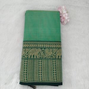 A classic Narayanan Pet saree crafted from mercerised cotton, featuring an elegant Lavanya type border with a running blouse for timeless charm.