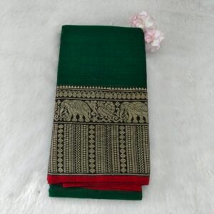 A classic Narayanan Pet saree crafted from mercerised cotton, featuring an elegant Lavanya type border with a running blouse for timeless charm.