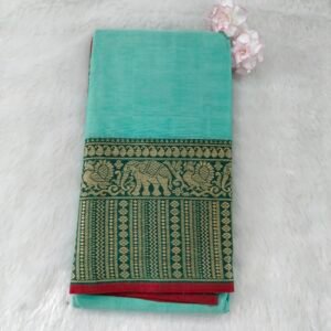 A classic Narayanan Pet saree crafted from mercerised cotton, featuring an elegant Lavanya type border with a running blouse for timeless charm.