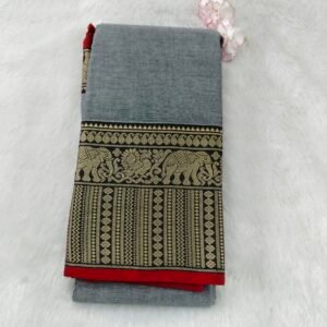 A classic Narayanan Pet saree crafted from mercerised cotton, featuring an elegant Lavanya type border with a running blouse for timeless charm.