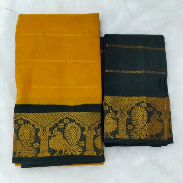 Radiant mustard yellow paired with a bold black border; contrast pallu and blouse for a classic look.