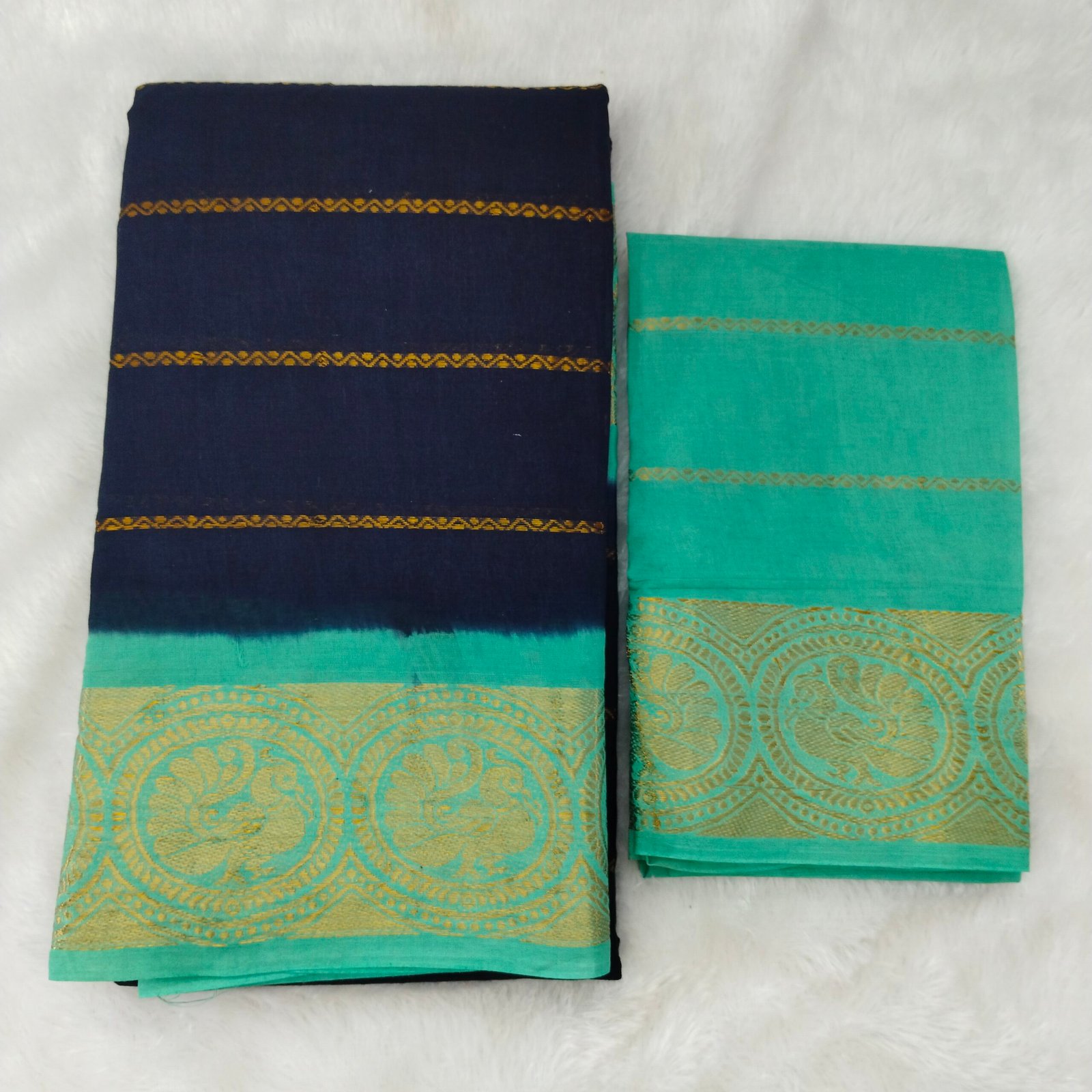 Deep navy with a fresh sea blue border; crisp contrast pallu and blouse for all-occasion elegance.