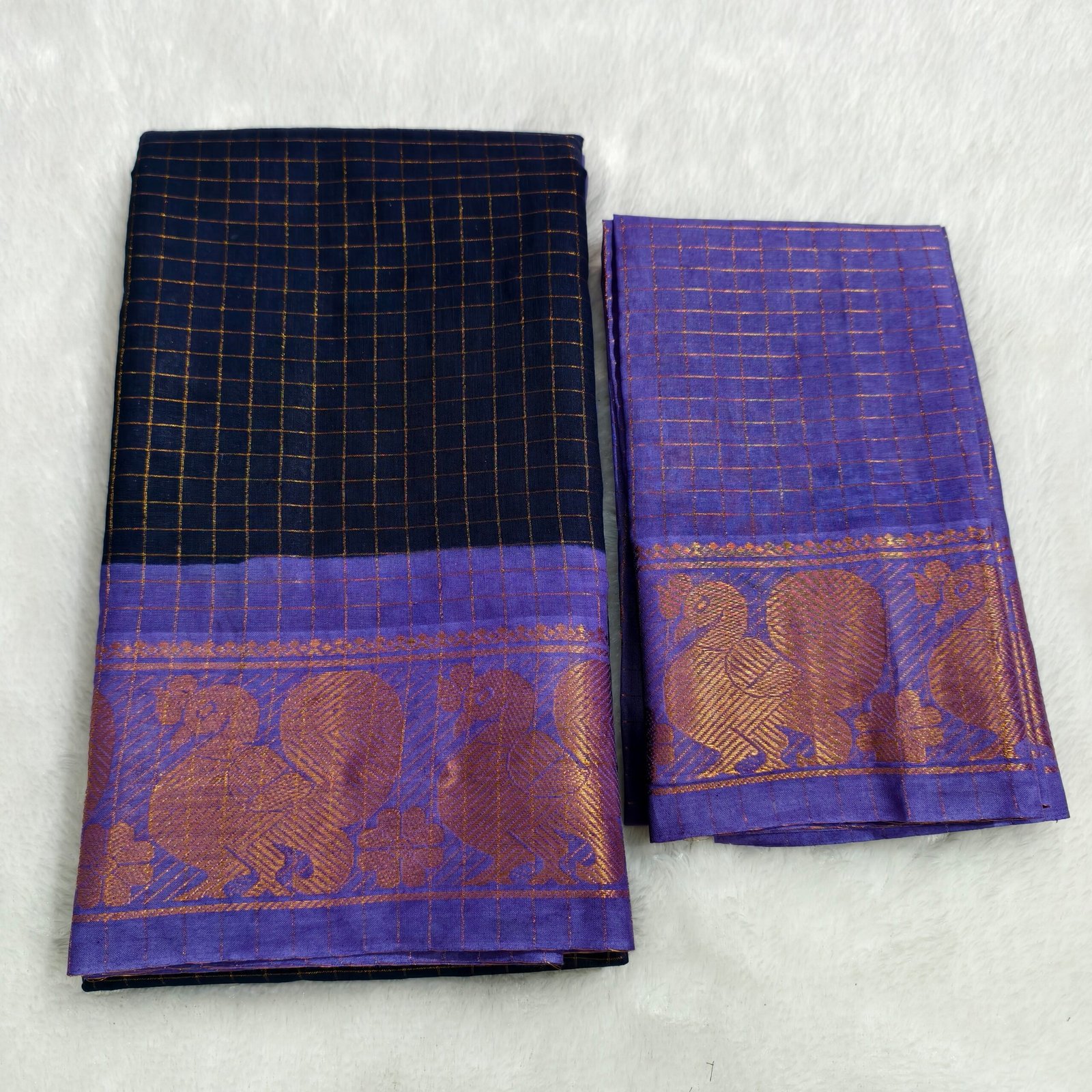 A premium soft cotton handloom Sungudi saree featuring gold zari kattam checks and a matching blouse—elegant, lightweight, and traditionally crafted
