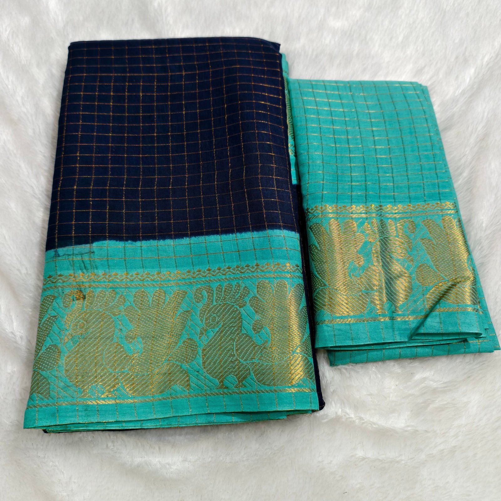 A premium soft cotton handloom Sungudi saree featuring gold zari kattam checks and a matching blouse—elegant, lightweight, and traditionally crafted