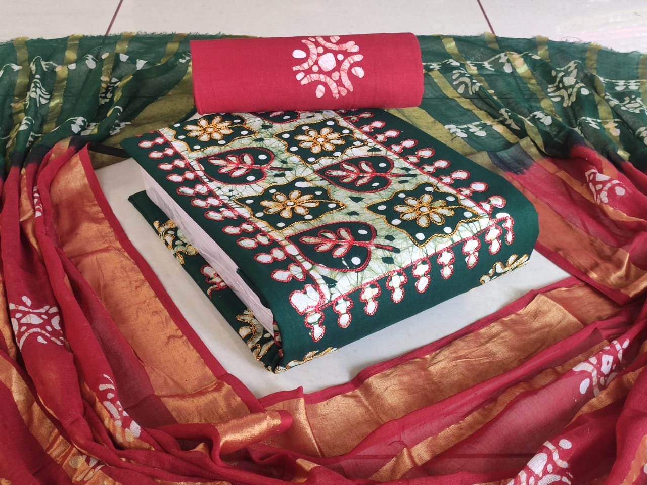 Elegant Batik cotton salwar material with intricate Kantha stitch work, including 2.40m top, 2.40m bottom, and 2.30m dupatta — perfect for stylish and comfortable ethnic wear.